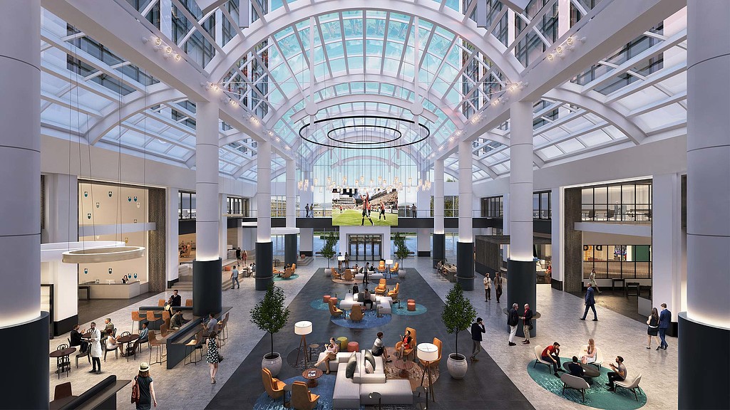 A large building with people and tables.